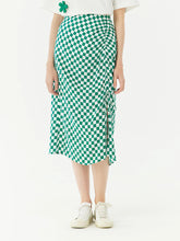 a woman in plaid checkerboard skirt